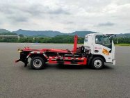 重汽豪曼藍綠牌純電動新能源HDW5040ZXXLBEV型純電動車廂可卸式垃圾車勾臂車